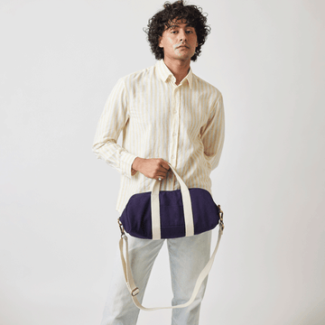 Compact Baba Bowler Bag (Mini) with sleek handles and a stylish silhouette.