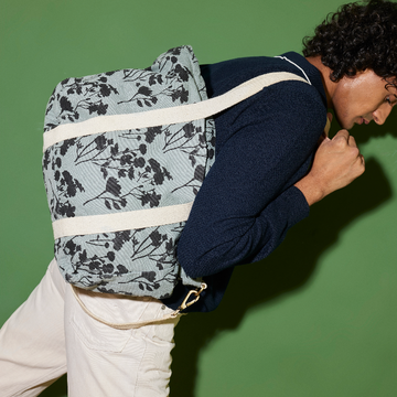 Elegant Sun J Bag with adjustable strap for versatile carrying.