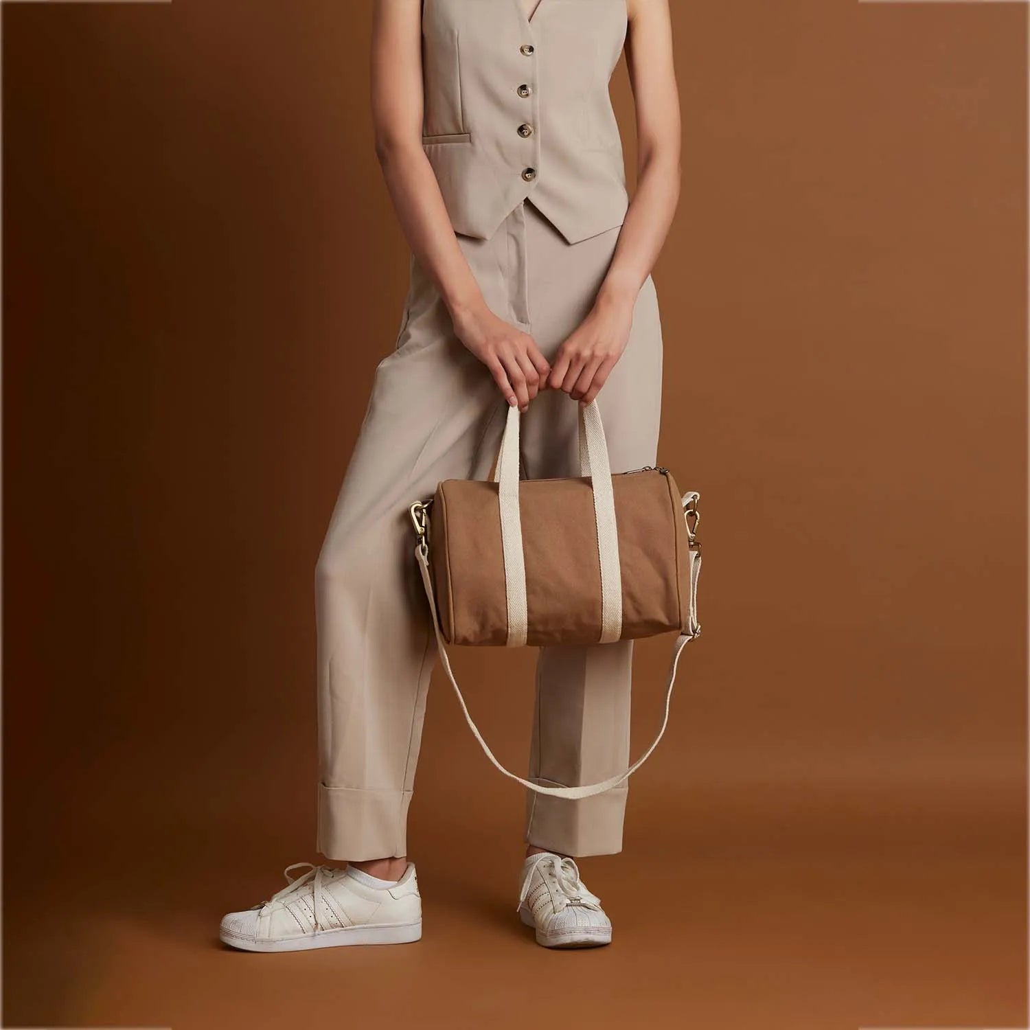Adjustable straps while carrying, our happy Boston hand duffle bag