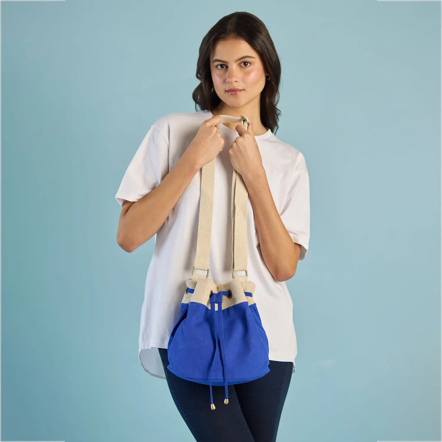 Ria Bucket Bag designed with a crossbody strap for easy carrying and stylish appeal