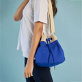 Ria Bucket Bag featuring eco-friendly cotton material with metal adjusters for added style