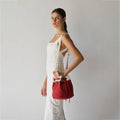 Stylish Ria Bucket Bag with traditional Indian print lining and adjustable metal hardware