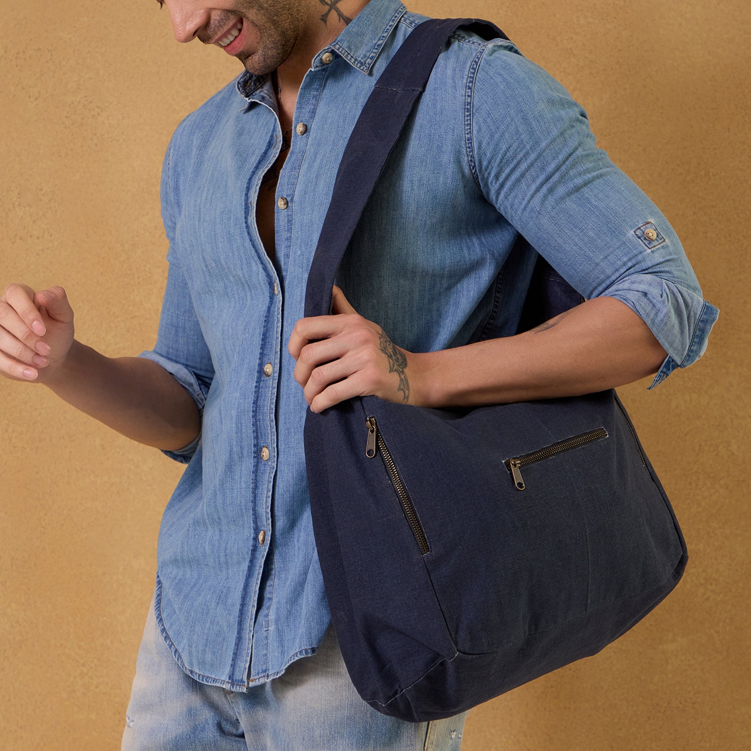 Model carrying the Jojo Hobo Bag - Small, perfect for daily essentials.