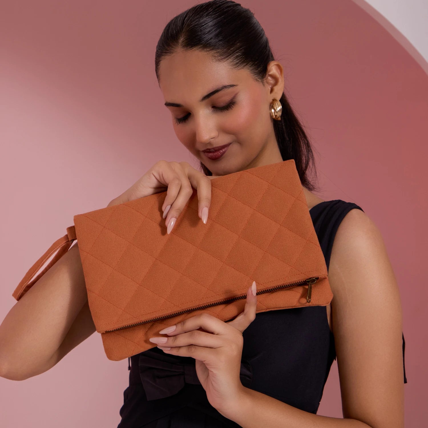It has room for small items. Check out our Krista Foldable women's clutch handbag