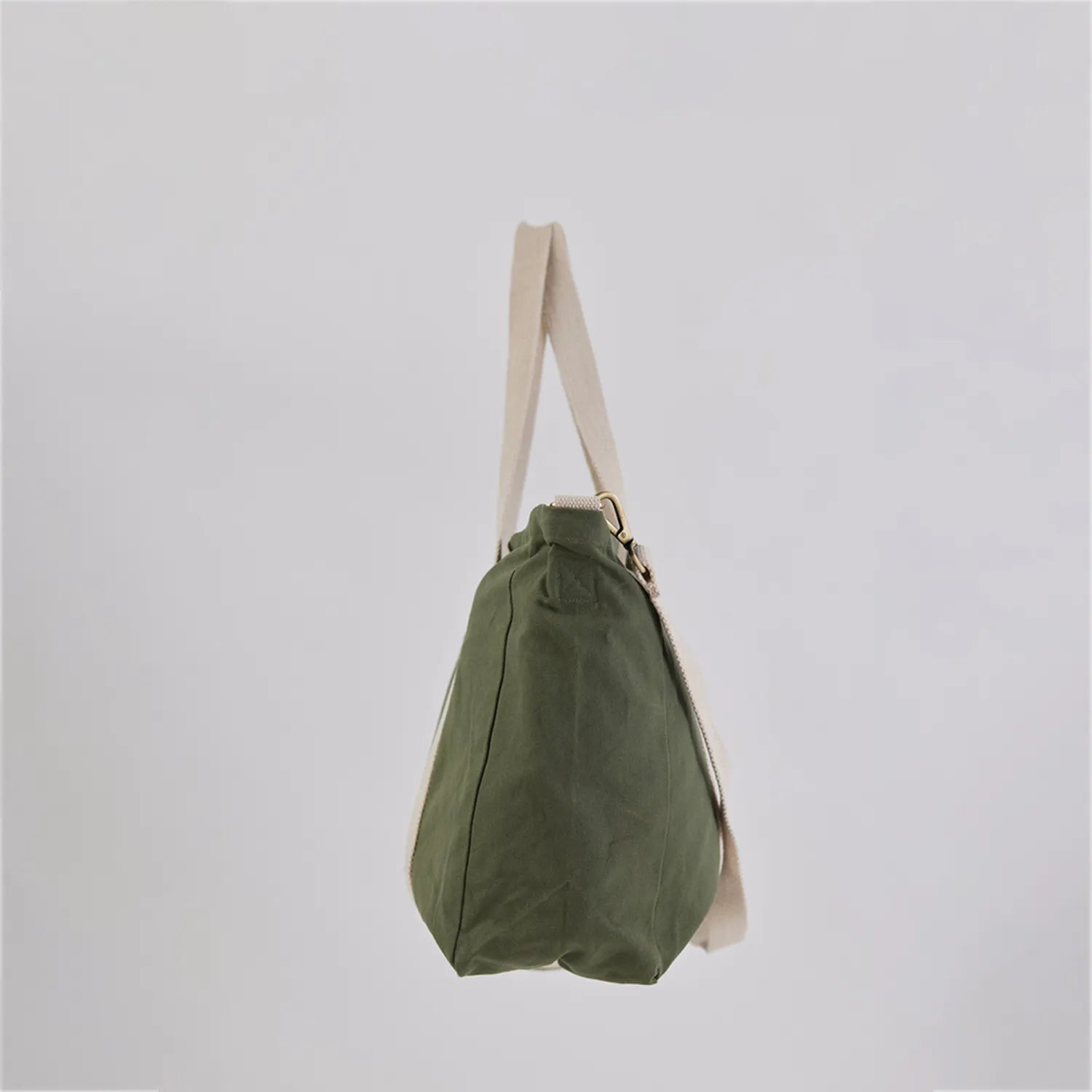 Elegant Sun J Bag in pastel yellow with an adjustable crossbody strap for versatile wear