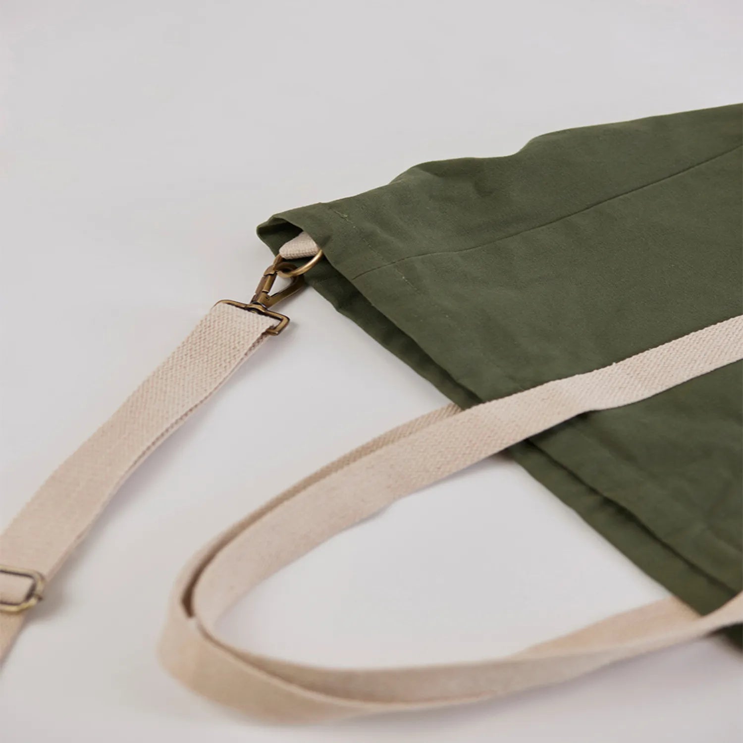 Sun J Bag Medium in bottle green with skin-friendly metal adjusters and secure zippers