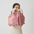 Ria Bucket Bag with a spacious interior and printed lining for a unique touch