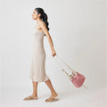 Ria Bucket Bag with a spacious interior and printed lining for a unique touch