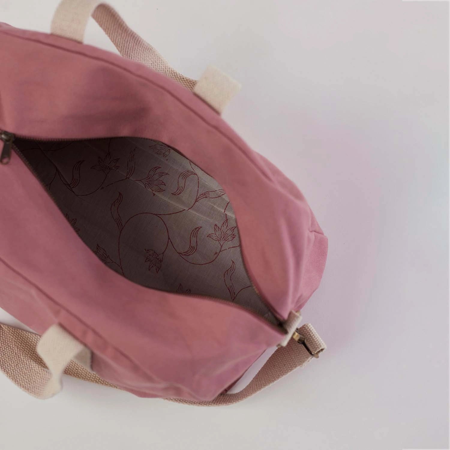The Pink Mini Baba Bowler Bag with a contemporary design.
