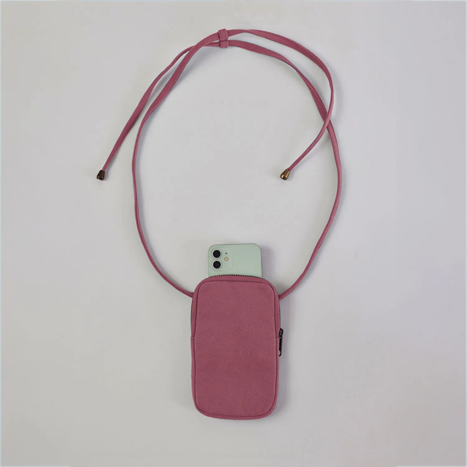 Crafted from cotton canvas, our Pastel Pink mobile sling bag online