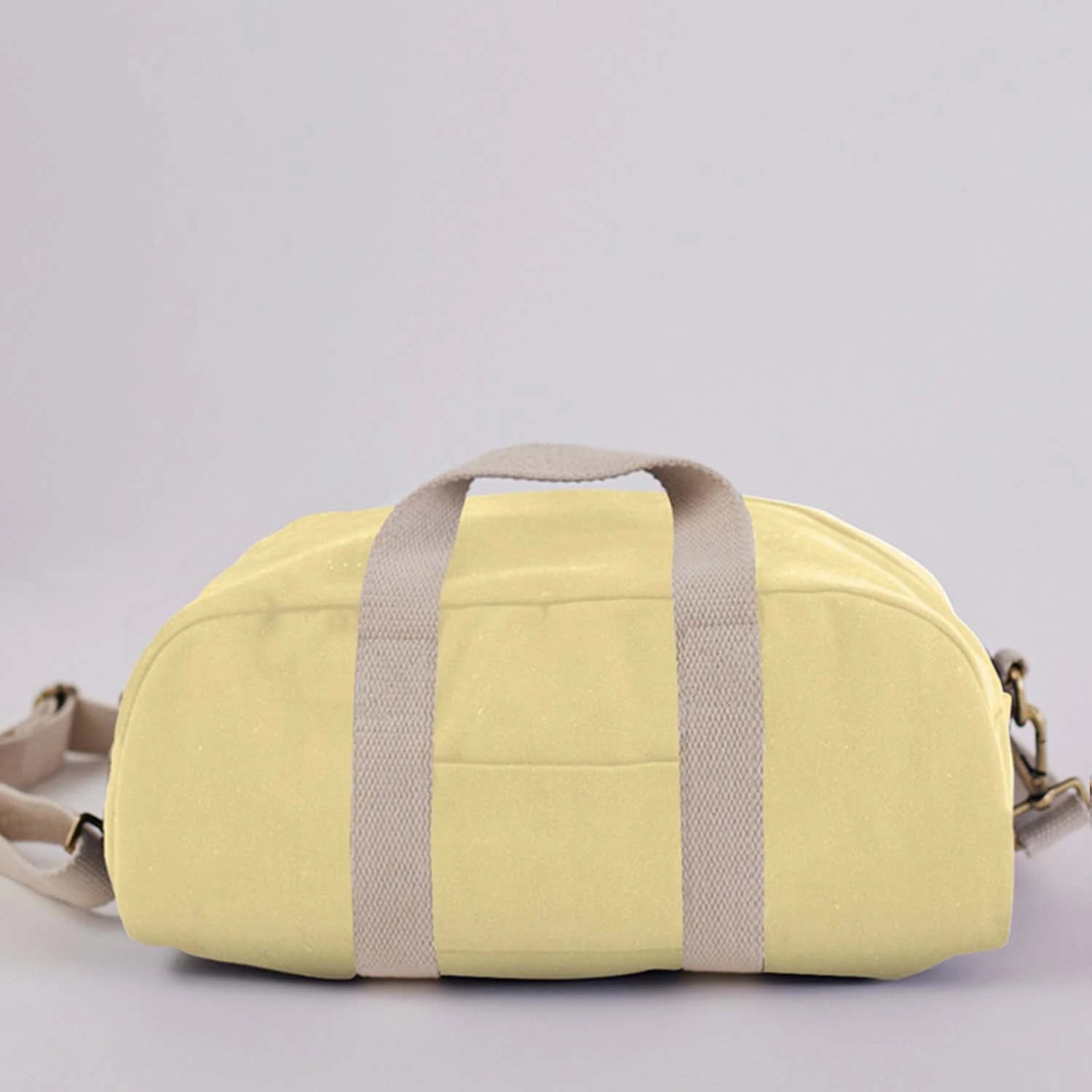 Mini Pastel Yellow Baba Bowler Bag made from high-quality cotton canvas.