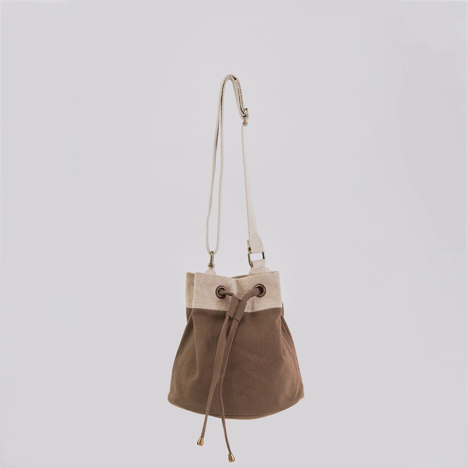 Ria Bucket Bag with a stylish crossbody strap and drawstring closure for easy access