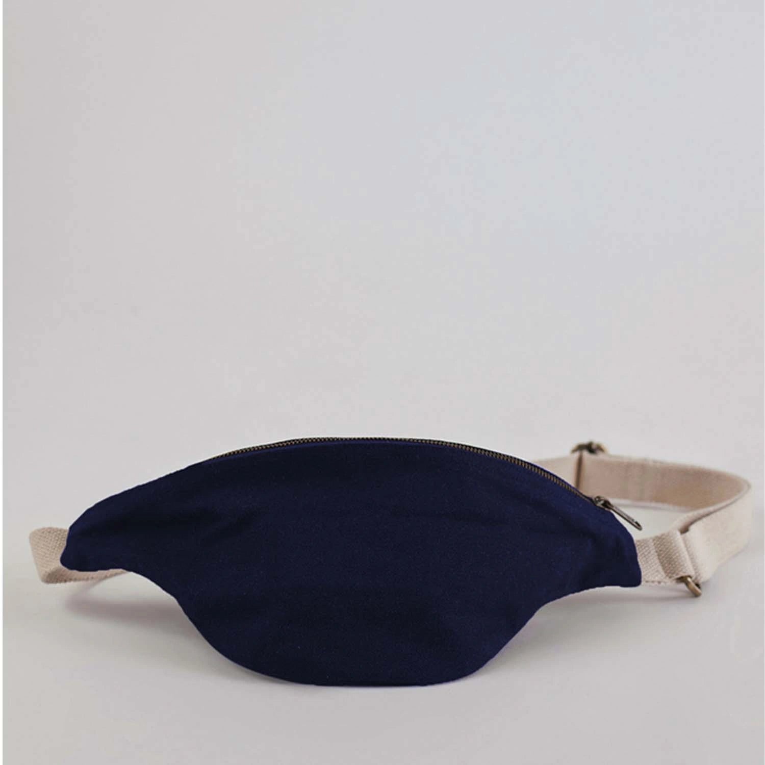 Model showcasing the versatility of the Safira Banana Bag Large in different outfits