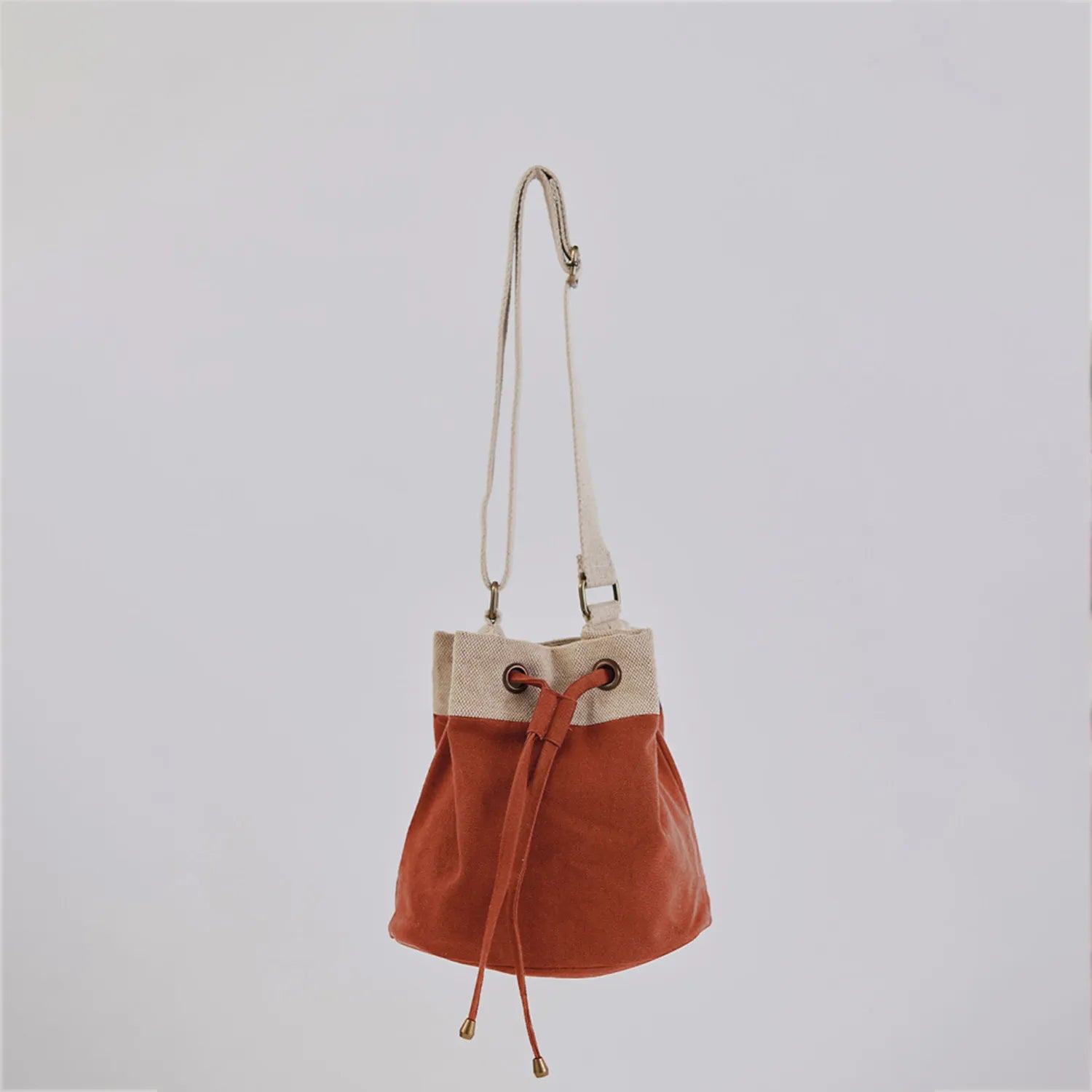 Trendy Ria Bucket Bag with a sleek design and adjustable strap for comfort