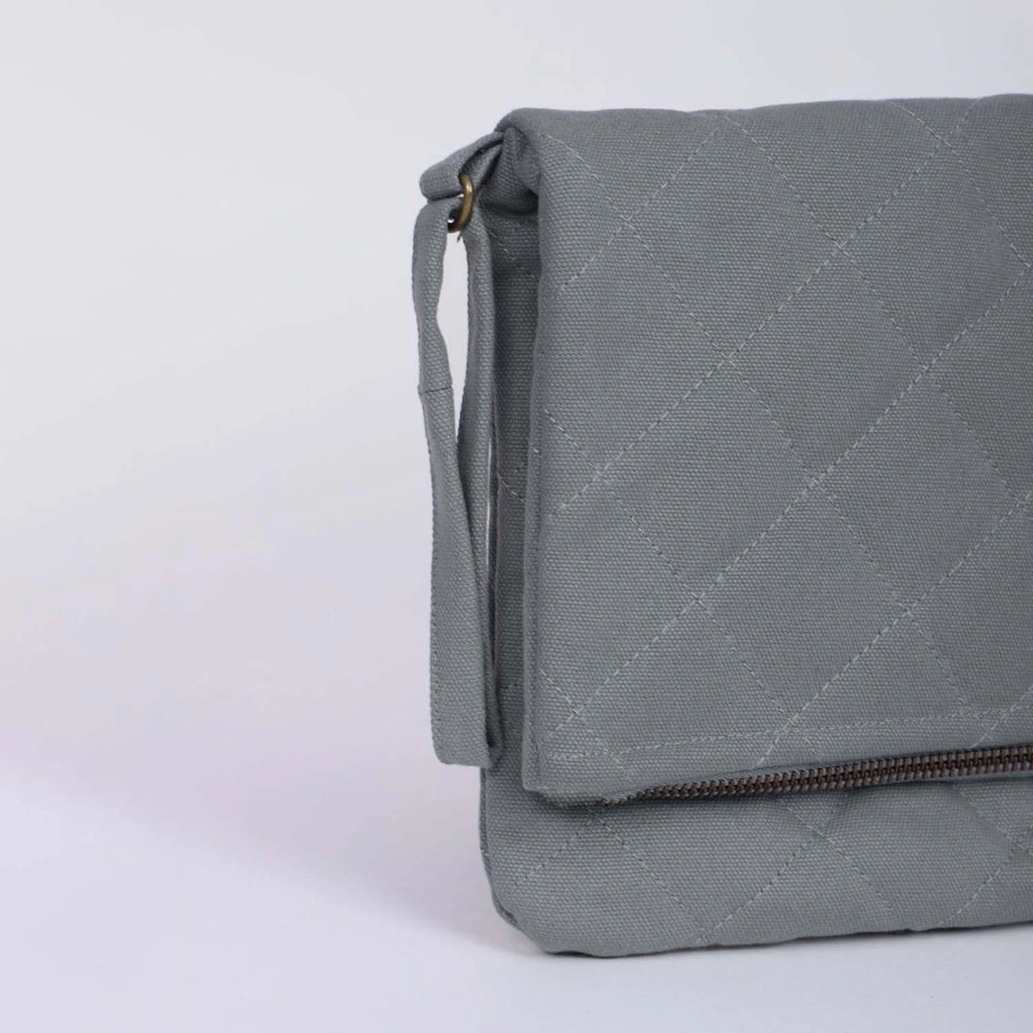 Discover our Krista Foldable Sage Green Clutch Bag Online
