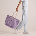 Crafted from cotton canvas, our or-he women's lilac tote bag