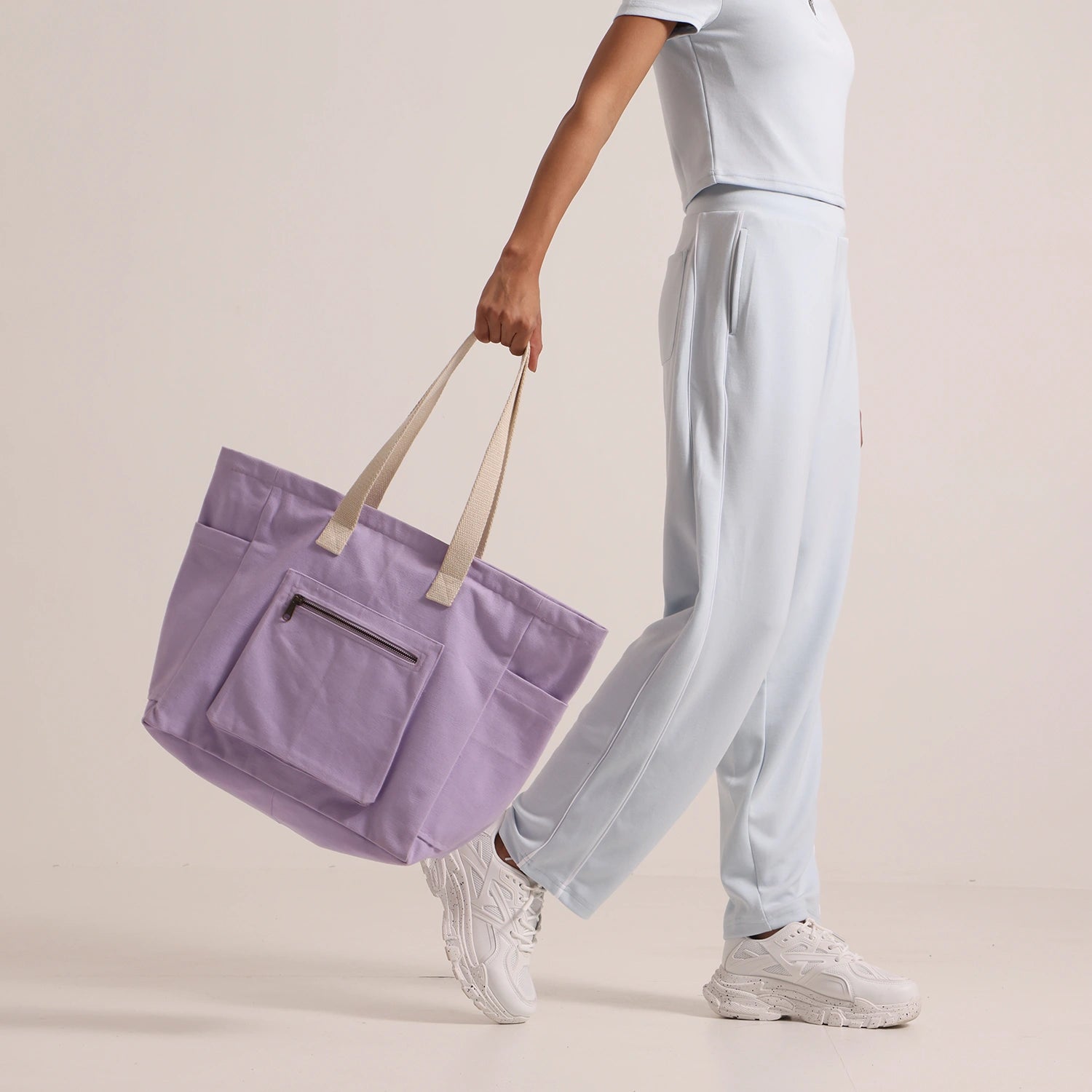 Crafted from cotton canvas, our or-he women's lilac tote bag