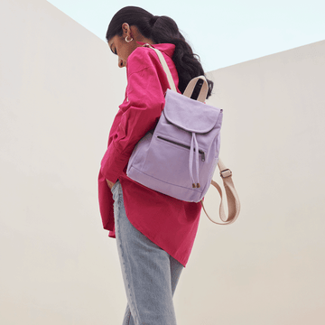 Modern  Harper Backpack with a front zip pocket and smooth finish.