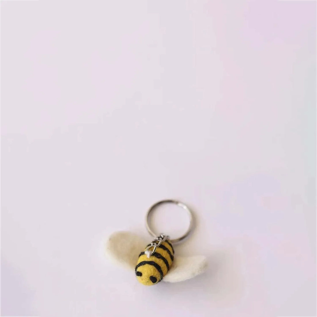 Playful "Honey Bee With Me" item with a charming bee character buzzing around with tiny wings and a sweet expression
