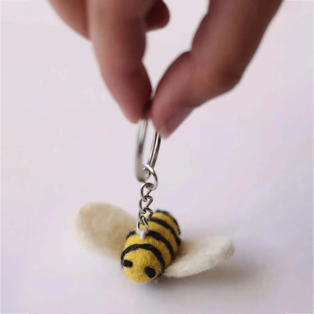 Playful "Honey Bee With Me" item with a charming bee character buzzing around with tiny wings and a sweet expression
