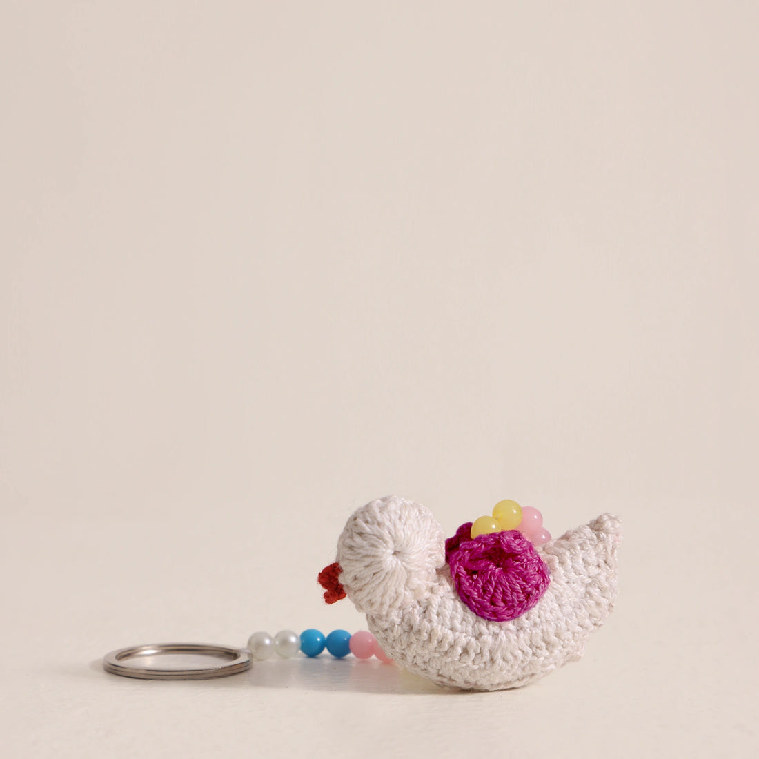 Elevate your style with our bird keychain at Dog D Originals