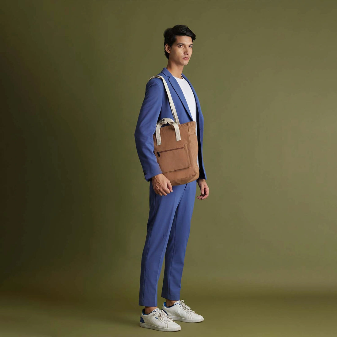 The Jamnagar Convertible Tote Backpack worn as a backpack on a model