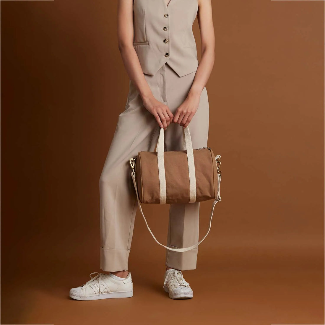 Adjustable straps while carrying, our happy Boston hand duffle bag