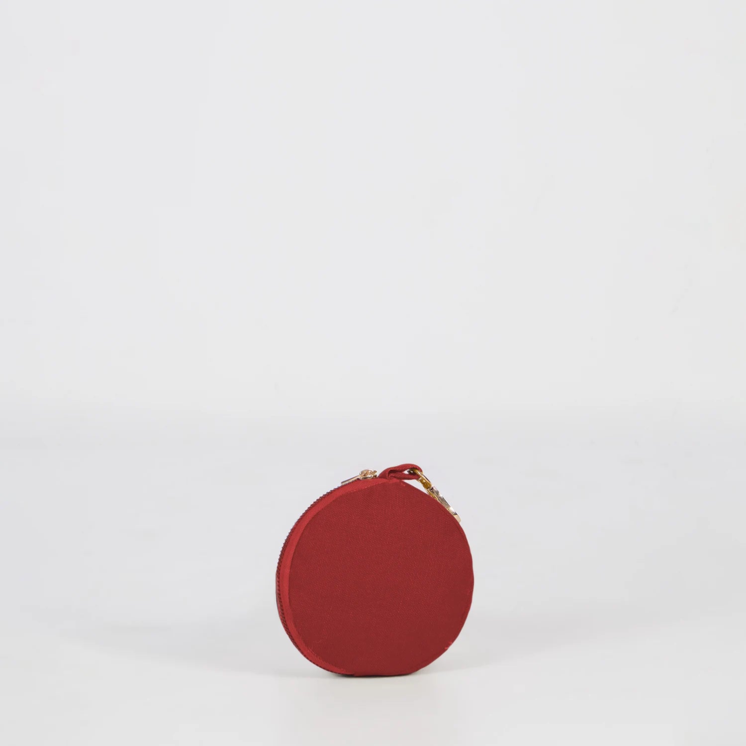 Crimson travel pouch for women offers stylish solution. Shop Now