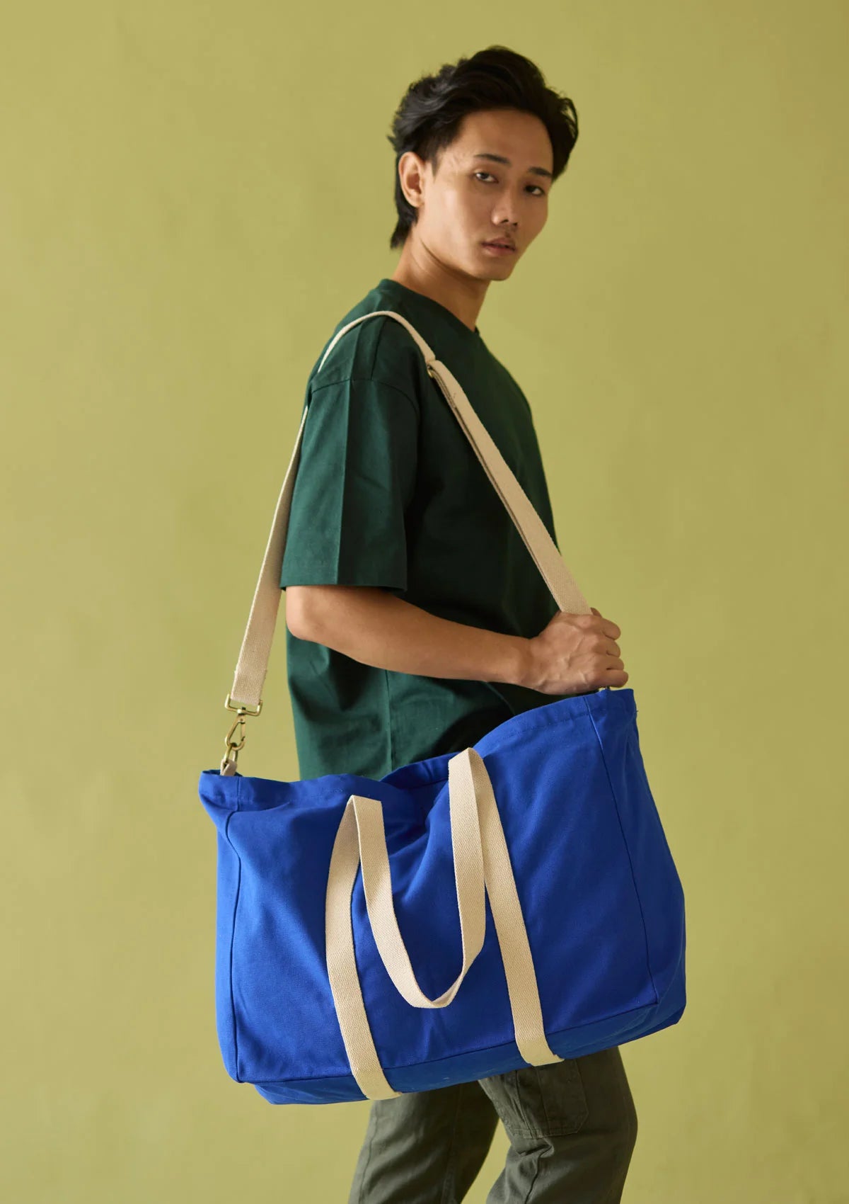 "Happy customer holding the Sun J Bag Large at a café."
