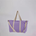 Sun J Bag Large in natural canvas color with minimalist design
