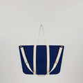 Sun J Bag  with top handle and adjustable crossbody strap designed for versatility