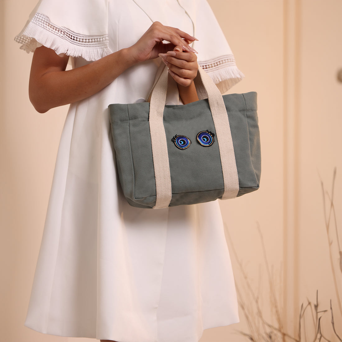 Shop the DOG D Originals Cutie Eyes Sun J Bag - Nano, a bold and playful statement piece